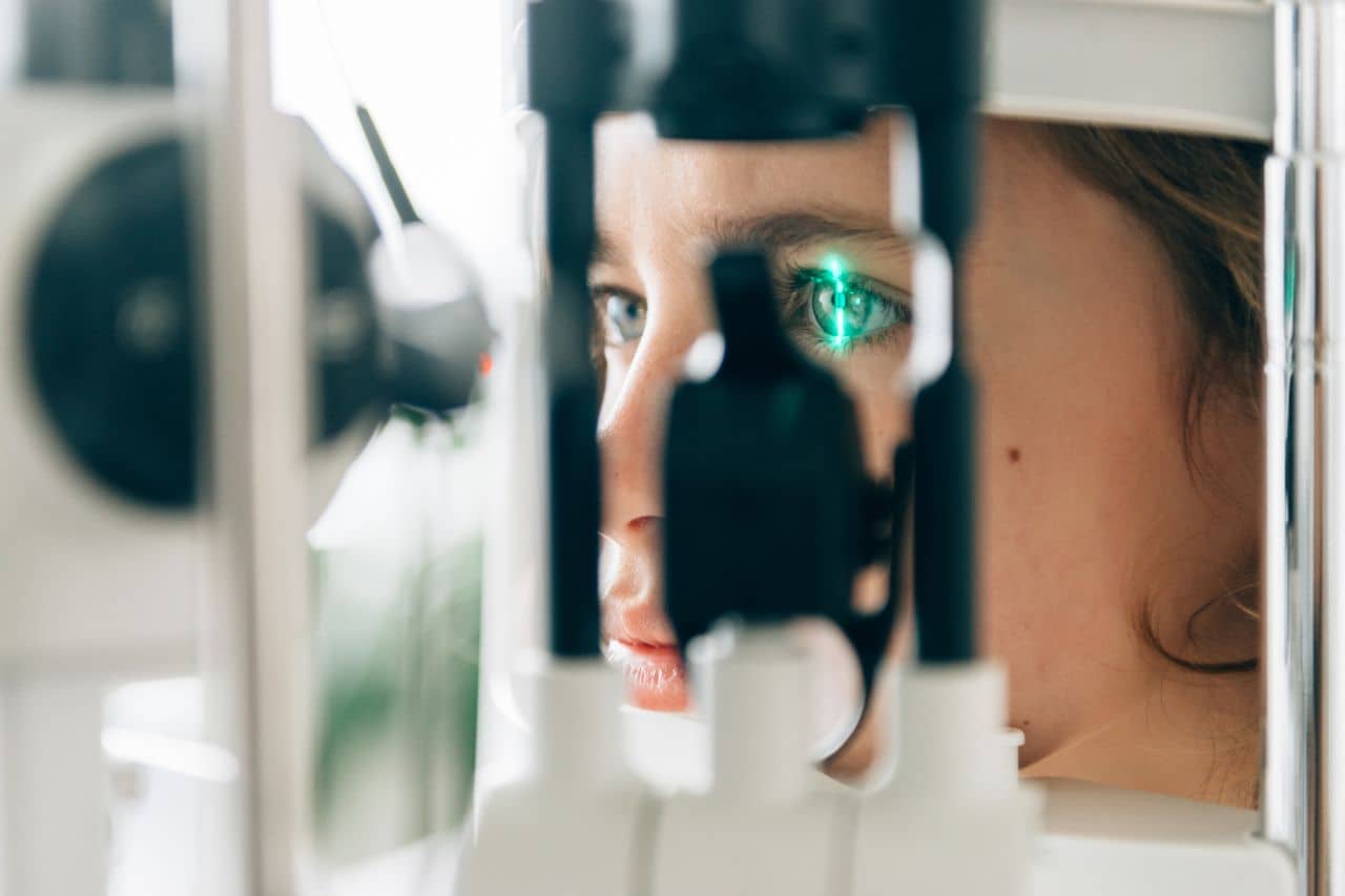Woman getting a retinal imaging scan