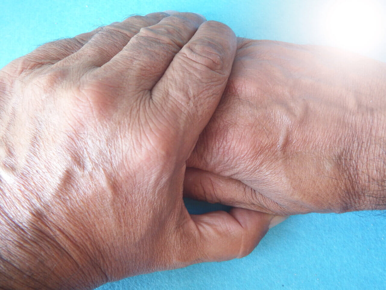 holding hands to stop parkinson's tremors